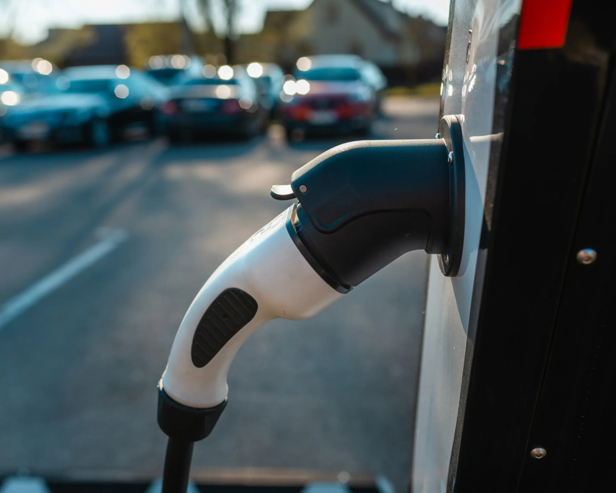 Electric vehicle charging connector plugged into an EV charging station | Primary Electric | Wasilla, AK